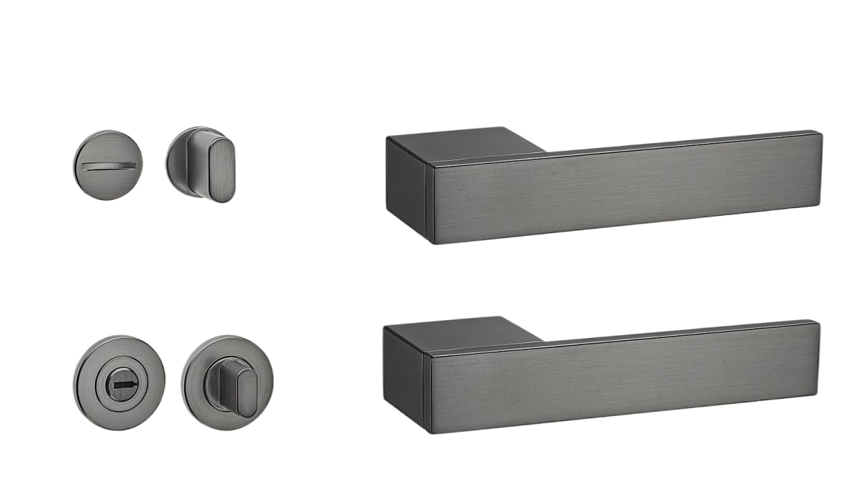 Set of black door handles and lock components on a white background