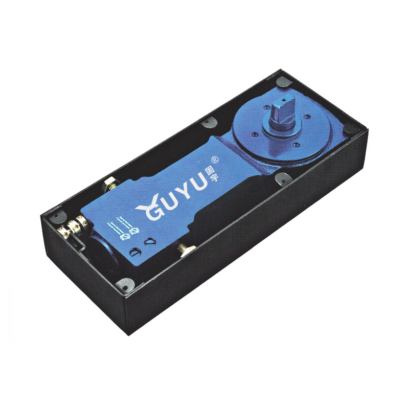 service-1 A GUYU brand floor spring (automatic door closer) with a black matte housing and internal blue components, displaying white "GUYU" text. The device features a square shaft for door connection, metal contacts, and screws, designed for bi-directional glass or heavy doors to ensure smooth closing, positioning, and sealing.