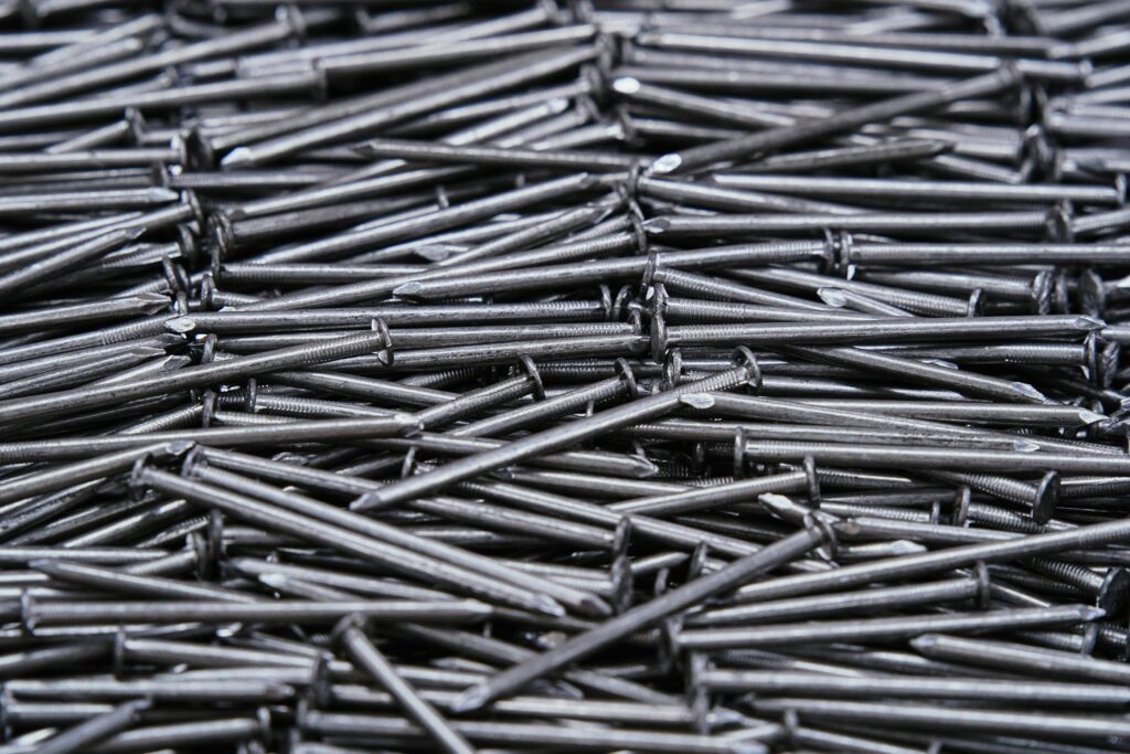 High-resolution image of numerous metal nails arranged closely together.